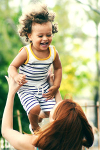Child playing with foster parent